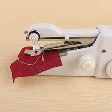 Compact handheld sewing machine with accessories